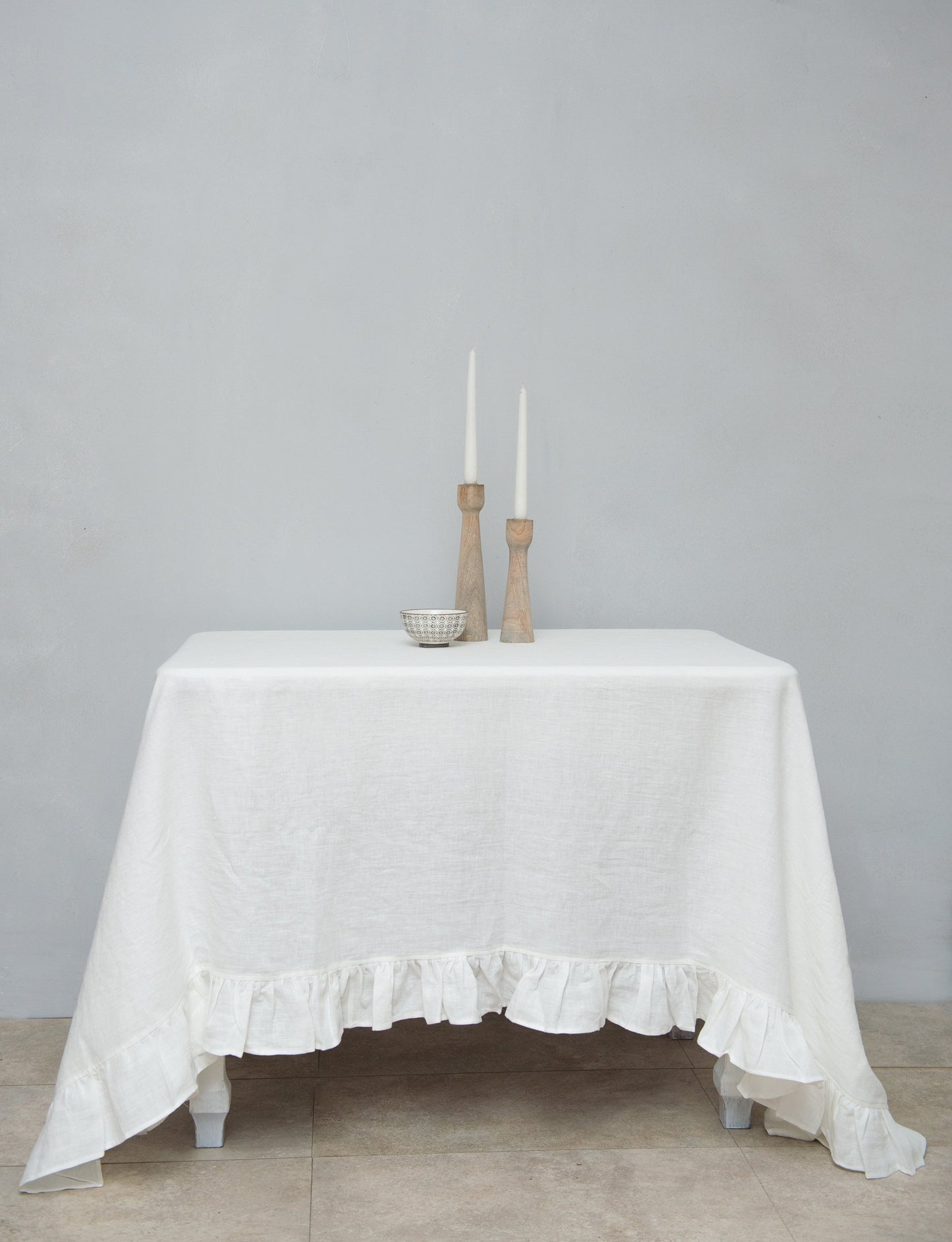 White linen tablecloth with ruffles