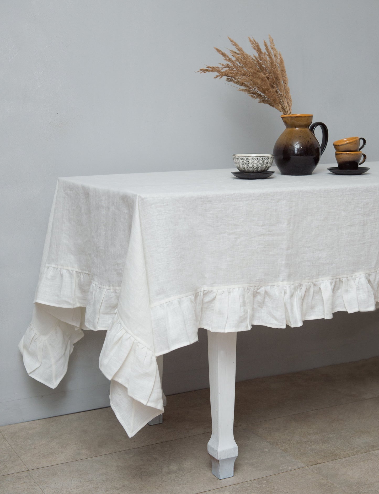 White linen tablecloth with ruffles