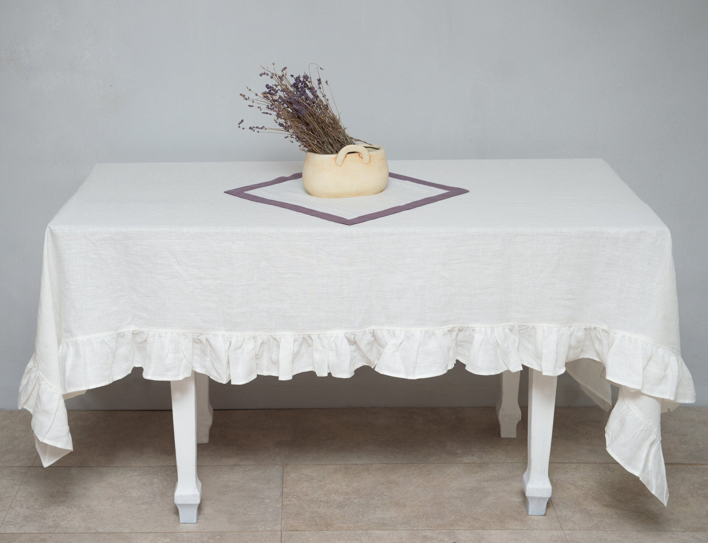 White linen tablecloth with ruffles