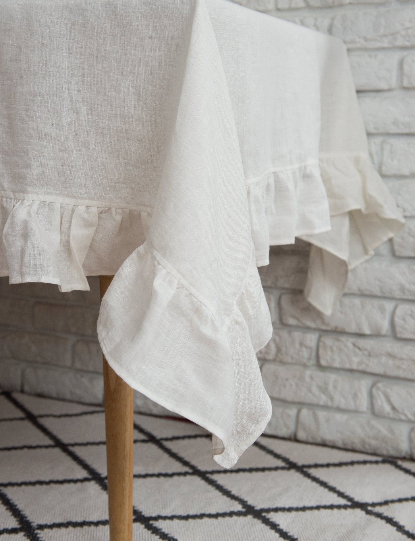 White linen tablecloth with ruffles